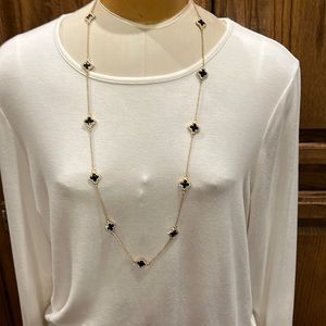 NWOT Gold necklace with black stones and clear rhinestones.